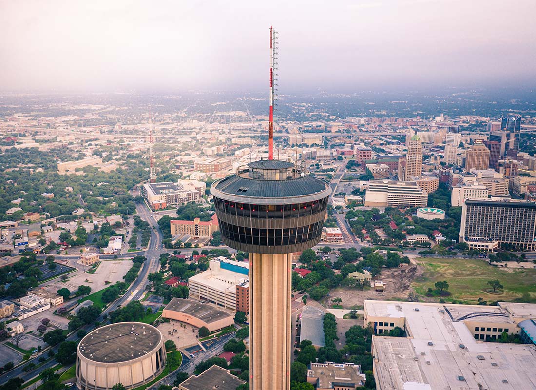 San Antonio, TX - Aerial View of a Tall Tower and Commercial Buildings in Downtown San Antonio Texas on a Sunny Day
